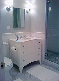 A vanity and combination mirror and medicine cabinet designed by River Forest handyman